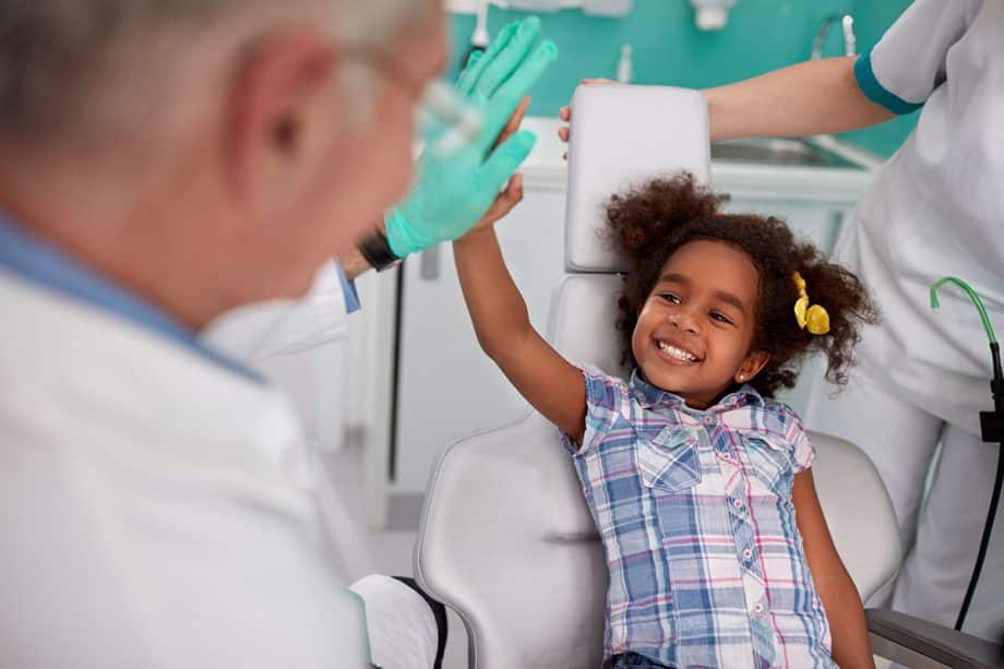Child high five dentist